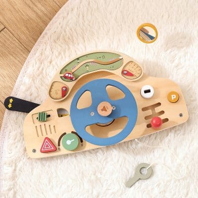 Multicolor wooden car dashboard toy with steering wheel, speedometer, and gear shift for kids, educational playset for early learning and motor skills development.