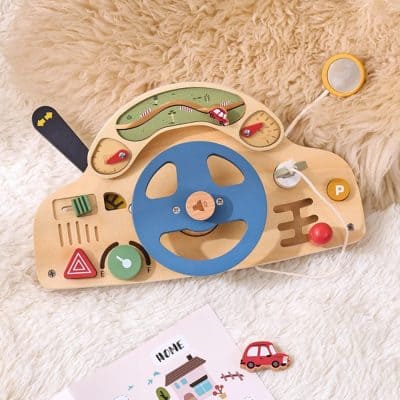 Colorful wooden car steering wheel toy for kids, with lights and sounds, ideal for early childhood development and educational play, available at Monalisa Medical.
