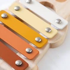 Colorful musical toy xylophone for children with metal mallets and wooden base, perfect for early childhood education and sensory play.