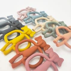 Colorful silicone elephant keychains in pastel shades and vibrant yellow, ideal as promotional items for optical stores and eye care clinics, showcasing playful branding accessories.