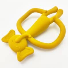 Yellow silicone baby teething toy shaped like a bunny, soft and safe for infants, available at Monalisa Medical Store for baby care and teething relief.