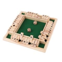 Colorful wooden Ludo game set with green playing surface, dice, and numbered pawns, perfect for family fun and entertainment.