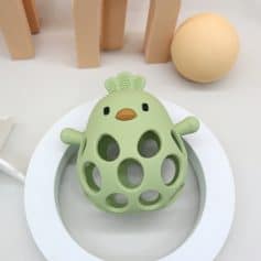 Plastic baby teething toy in the shape of a chick with multiple holes and small wings, featured in soft pastel green color, designed for infants, made from safe silicone material.