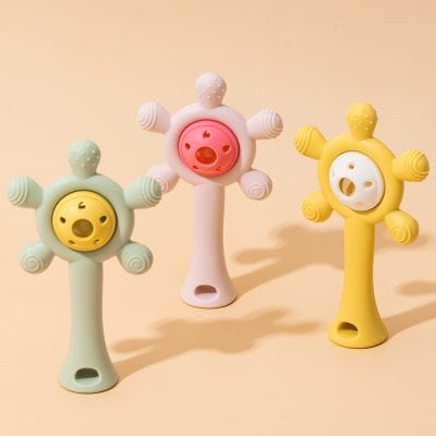 Colorful children's teething toys with star shapes, soft silicone material, and playful design, ideal for babies and toddlers. Bright pastel colors include green, pink, and yellow, perfect for soothing gums.