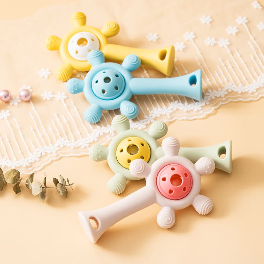 Colorful baby safety teething toys in pastel shades for infant gum relief and sensory play. Perfect for nurturing healthy oral development in young children.