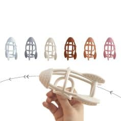 Colorful plastic baby teethers in various pastel shades, designed for infant oral health and teething relief. Perfect for soothing babies during teething stages.