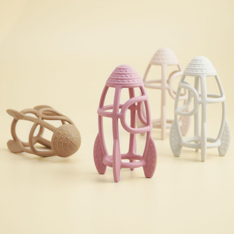 Colorful baby teething toys in spaceship design, perfect for infant oral health, online at Monalisa Medical Store.