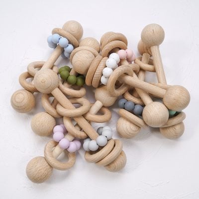 Natural wooden baby teething toy set with colorful silicone beads, safe for infants.