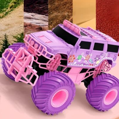 Pink and purple toy monster truck with floral decals, rugged tires, and detailed design, ideal for children's entertainment and outdoor play.
