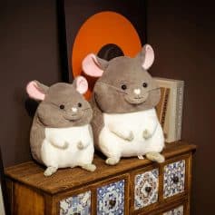 Cute mouse plush toys sitting on a wooden cabinet, ideal for cozy home decor or as gift ideas, perfect for children's rooms or nursery decor, featuring soft fabric and charming design.