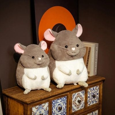 Cute mouse plush toys sitting on a wooden cabinet, ideal for cozy home decor or as gift ideas, perfect for children's rooms or nursery decor, featuring soft fabric and charming design.