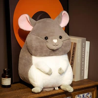 Soft plush mouse stuffed toy on a bookshelf, ideal for children's decor and gifts, featuring cute design with large ears and expressive eyes, perfect for cozy nursery or bedroom accessory.