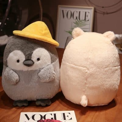 Cute stuffed penguin plush toy wearing a yellow hat, adorable animal plush with soft texture, perfect for kids' toys and gift shops.