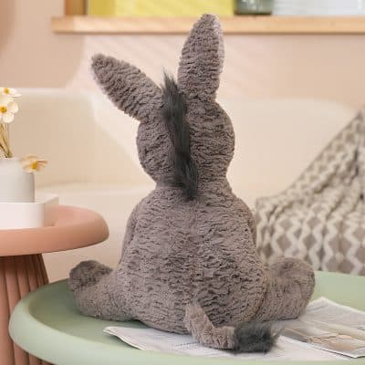 Plush rabbit toy on pastel-colored table, cozy home decor, soft stuffed animal for kids, gift for children, playful and cute soft toy, Monalisa Store opt.