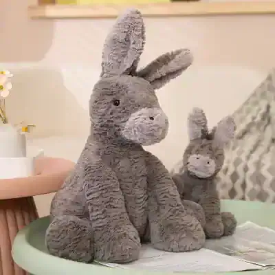 Gray plush bunny stuffed animal, soft and cuddly, perfect for children or as a decorative item at Monalisa Store opt. Ideal for gifts or cozy home decor, featuring detailed stitching and adorable facial expression.