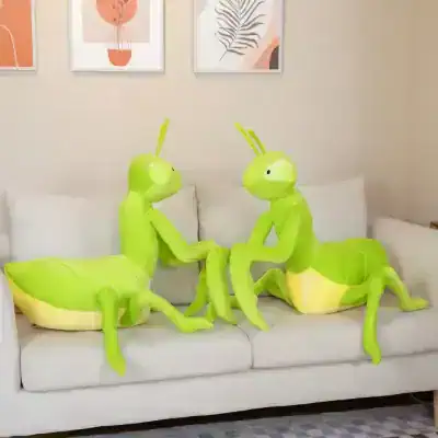 Colorful leaf-inspired insect plush toys on a beige sofa in a modern living room setting.