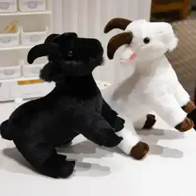Black and white plush goat stuffed animals, soft and cuddly, ideal for children and collectors, available at Monalisa Store.