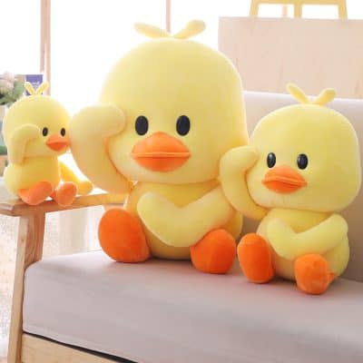 Soft yellow duck plush toys with orange beaks and feet, cute and cuddly, perfect for kids' room decor or gifts.