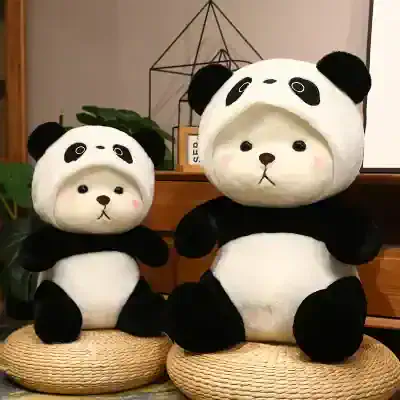 Cute panda plush toys with black and white fur, perfect for children's bedrooms or cozy home decor.