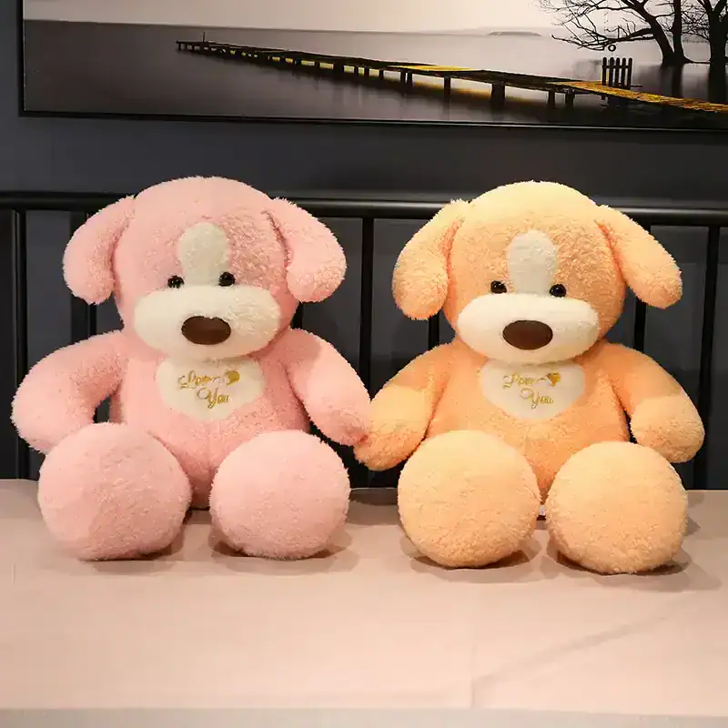 Soft pink and orange plush teddy bears with "Love You" embroidery, perfect for gift-giving or home decor. Made from high-quality, cuddly material, ideal for children and teddy bear enthusiasts.