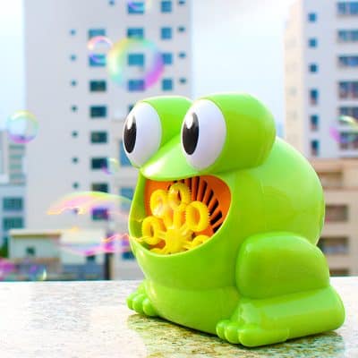 Colorful frog-shaped bubble machine for kids, perfect for outdoor play and entertainment, available at Monalisa Store for fun and novelty gifts.