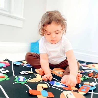 Colorful kids' educational play mat with animal and space-themed foam puzzles, perfect for early learning, motor skills development, and imaginative play for children.