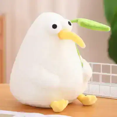 Cute plush bird with a green leaf beak, soft and adorable, perfect for home decor or gifts.