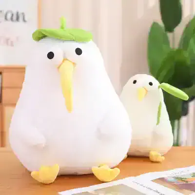 Soft plush bird decor with cute chick design, perfect for nursery or home decor, featuring bright yellow beak and feet, green leaf hat, ideal for children’s room or gift customization.