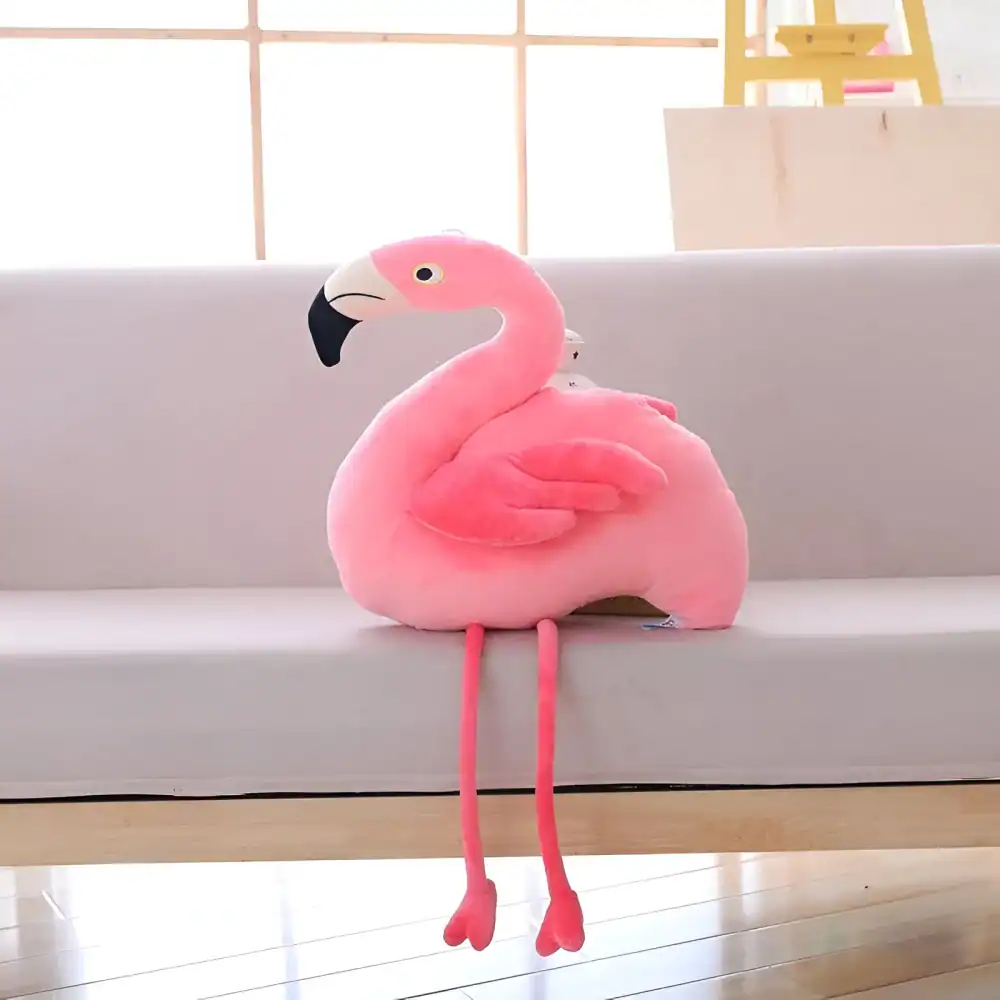 Pink flamingo plush toy for home decor and gifts, featuring soft fabric and cute design, perfect for creating a cheerful atmosphere in living spaces. Great for kids and animal lovers.