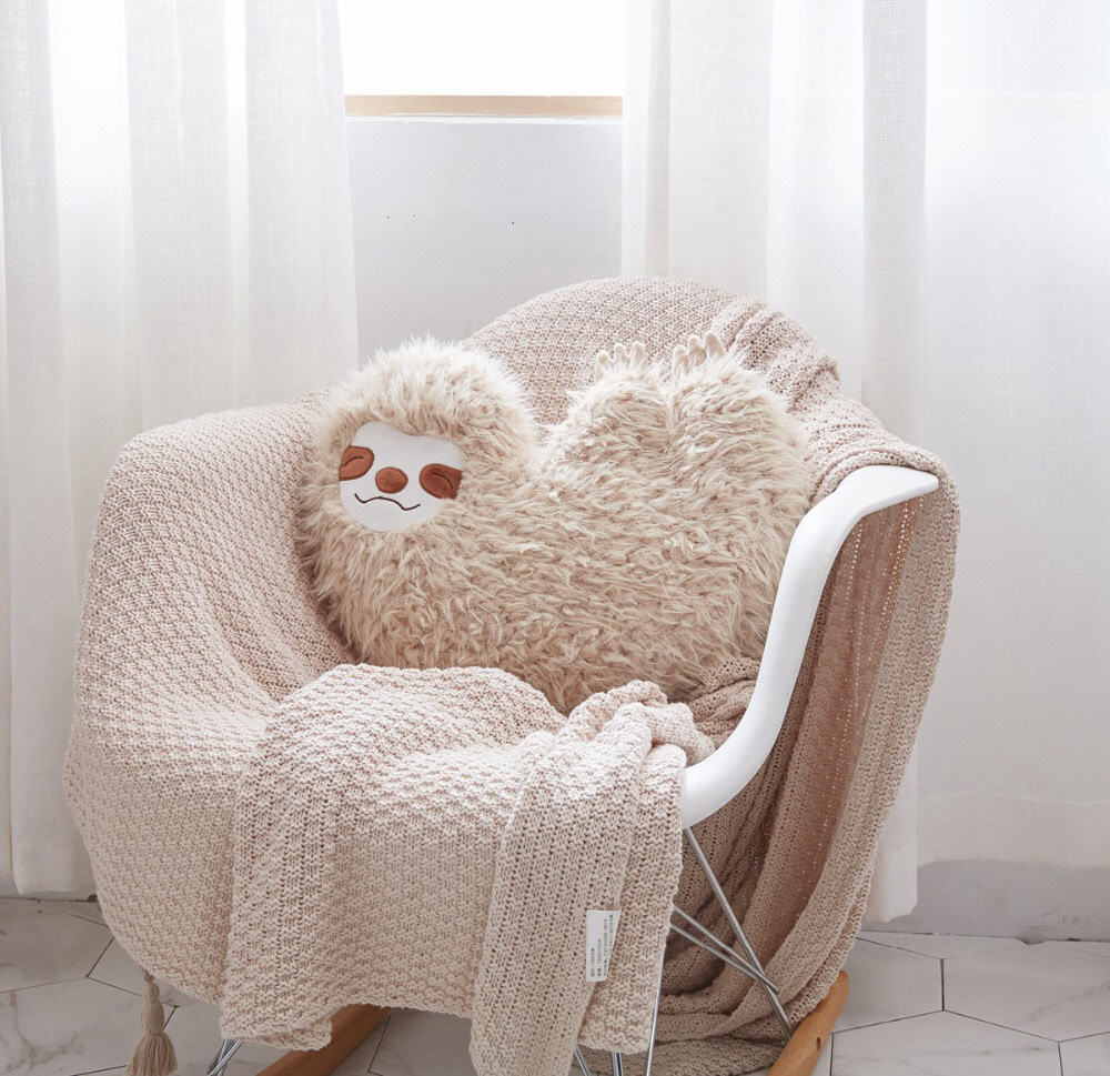 Soft plush corner sofa with decorative cushions, perfect for cozy home decor and relaxation at Monalisa Medical Store.