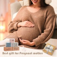 Comfy pregnant woman in cozy sweater holding her belly at home.
