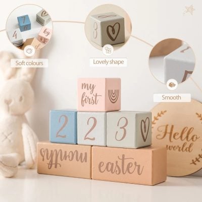 Soft pastel-colored wooden blocks for babies, featuring numbers, shapes, and words like