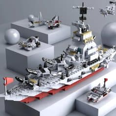Lego space battleship toy with missiles and AAA guns on gray background.