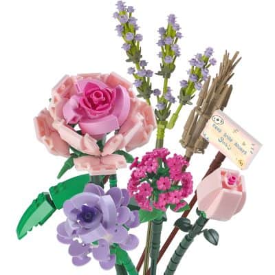 Vivid LEGO flower bouquet set featuring pink, purple, and lavender blossoms with green stems and a motivational message sign, perfect for decorative or gift purposes.