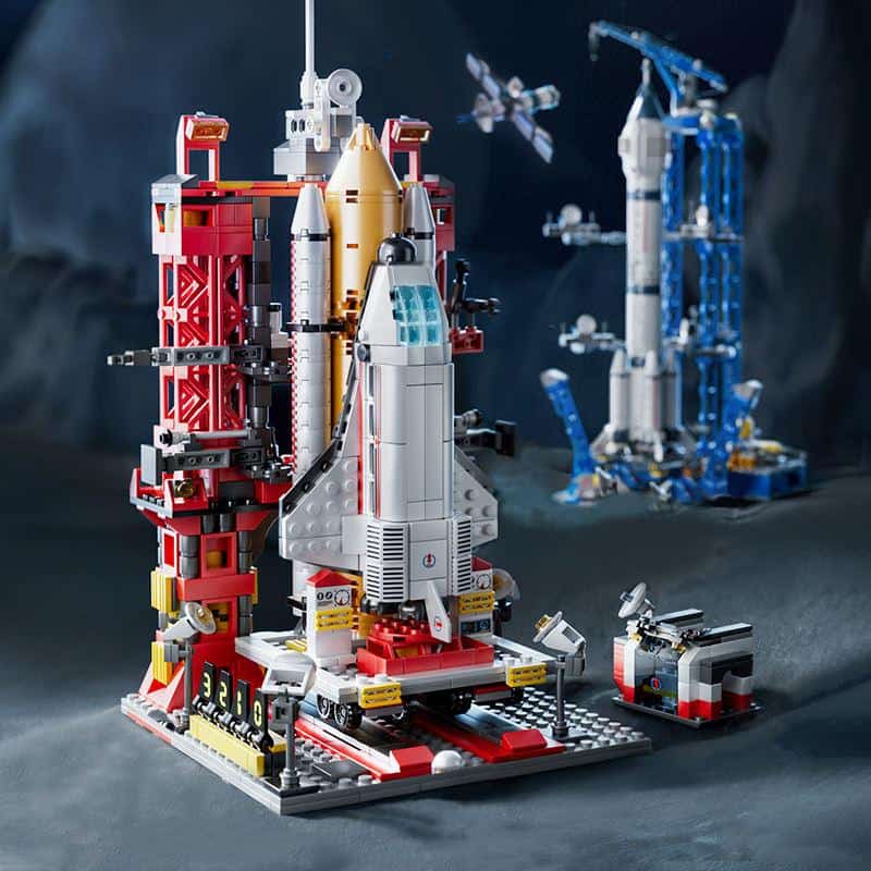 Detailed LEGO space rocket ship model on a launchpad with surrounding spacecraft and technical details at Monalisa Store, emphasizing innovative space exploration and LEGO building kits.