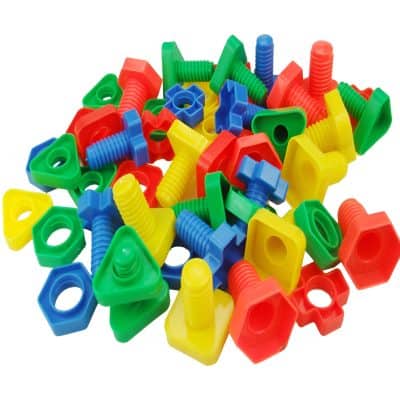 Plastic screws and nuts in bright red, blue, yellow, and green, used for educational and DIY projects, emphasizing children’s toys, classroom activities, and creative assembly.