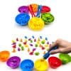 Colorful magnetic dress-up toys for children, including small animal and dinosaur figurines with storage bowls, enhancing fine motor skills and creativity.