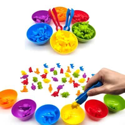 Colorful magnetic dress-up toys for children, including small animal and dinosaur figurines with storage bowls, enhancing fine motor skills and creativity.
