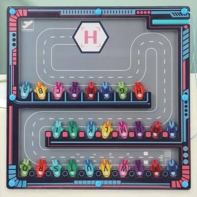 Colorful toy race track with miniature cars spelling "HAPPY BIRTHDAY" - fun educational toy for children.