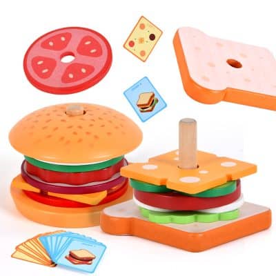 Colorful wooden toy food set including burger, sandwich, and pizza slices indoors, ideal for children's imaginative play and educational activities.