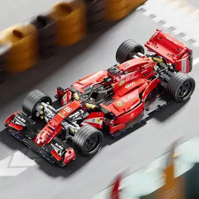 Lego Ferrari Formula 1 race car on a racing track, detailed and realistic model, high speeds, motion blur, competitive racing scene, ideal for toy and sports car enthusiasts, showcasing LEGO craftsmanship.