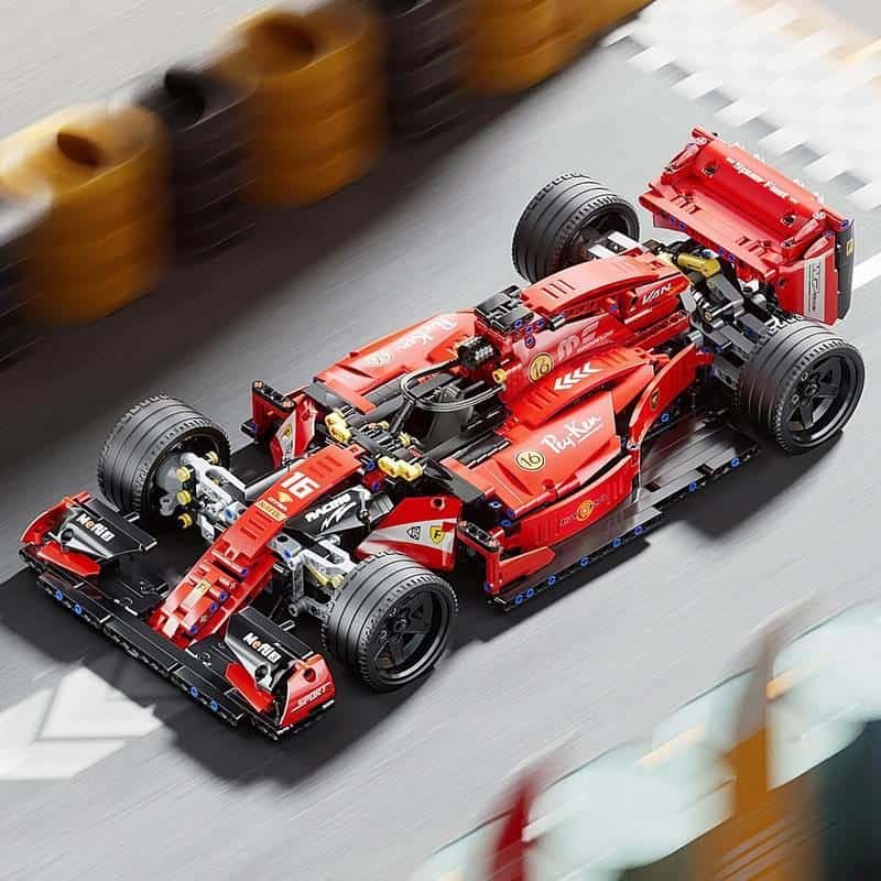Vera Lego Formula 1 car racing on track at Monalisa Store, detailed red racing vehicle built with Lego bricks, showcasing high speed, precision engineering, and innovative design for racing enthusiasts.