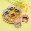 Cute lion-shaped soft silicone hair clips in pastel colors on wicker tray, ideal for kids girls, trendy fashion accessory for children, Monalisa Medical Store.