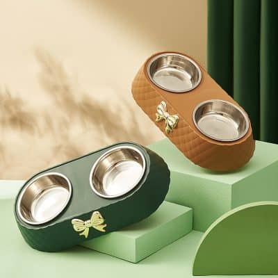 Dog food bowls with decorative bow accents, available in stylish green and brown colors - perfect for pet feeding at Monalisa Store.