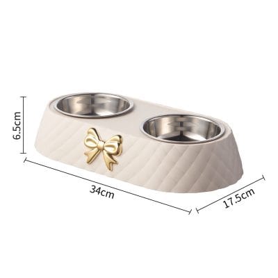 Elegant dual pet food bowl stand with stainless steel containers and decorative bow, perfect for stylish pet dining. Measures 34cm x 17.5cm x 6.5cm, ideal for keeping your pet's feeding area clean and organized.
