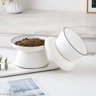 Silky white ceramic bowls with black rim accents, stylishly designed for modern home decor and storage, perfect for organizing daily essentials or serving small snacks.