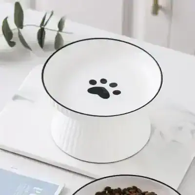 Pet food dispenser with paw print design for easy pet feeding, perfect for cats and dogs. Keep your pet's food fresh and accessible with this stylish and functional automatic pet feeder.