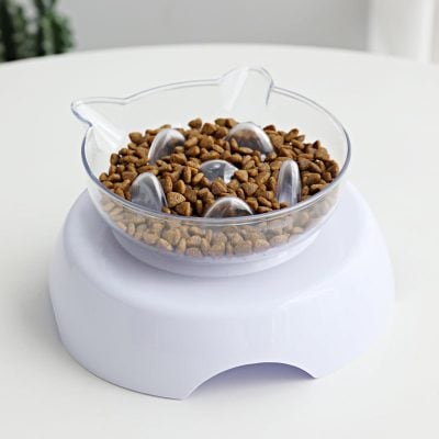 Dry pet food dispensing bowl with adjustable metal spoons for convenient feeding.