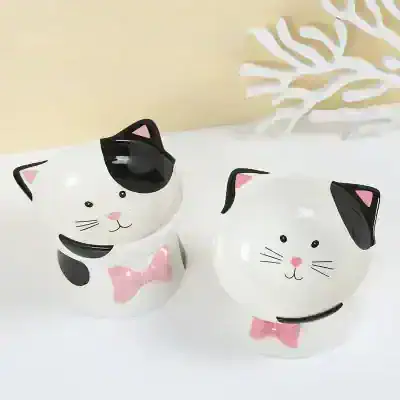 Cute cat-shaped storage containers with pink bows, perfect for home decor or gifting, available at Monalisa Store.