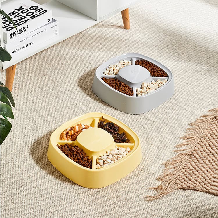 Bowl with divided sections containing pet food, on beige carpet, Monalisa Store pet feeding accessories.